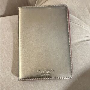 kate spade metallic gold passport cover with pink edge trim